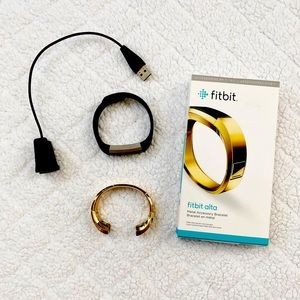 Used Fitbit Alta (small), charger, and gold bangle. Charged and ready to use!